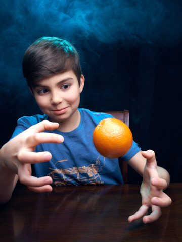 photo of boy doing magic
