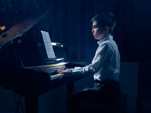 picture of boy playing piano